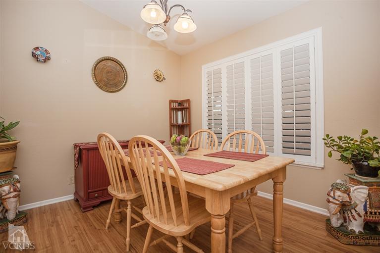 13648 Laurelhurst Road Moorpark, CA 93021 - Photo 8 of 32 a view of a dining room with furniture window and wooden floor