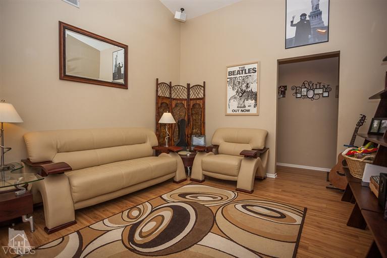 13648 Laurelhurst Road Moorpark, CA 93021 - Photo 10 of 32 a living room with furniture a couch and wooden floor