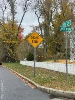 a view of a street with sign board