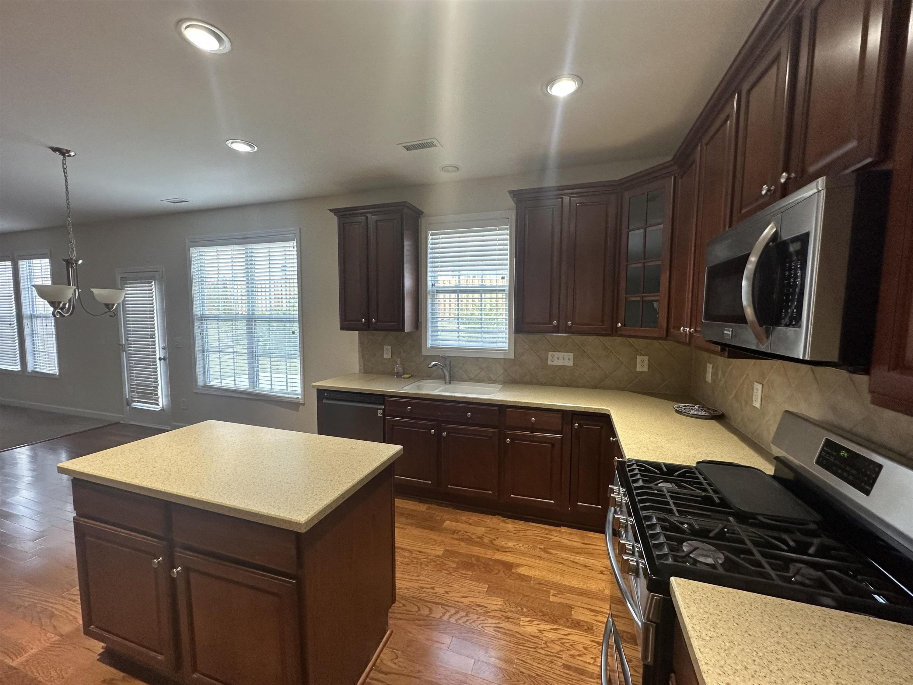 5161 Holly Ridge Farm Road Raleigh, NC 27616 - Photo 14 of 35 a kitchen with a sink appliances and cabinets