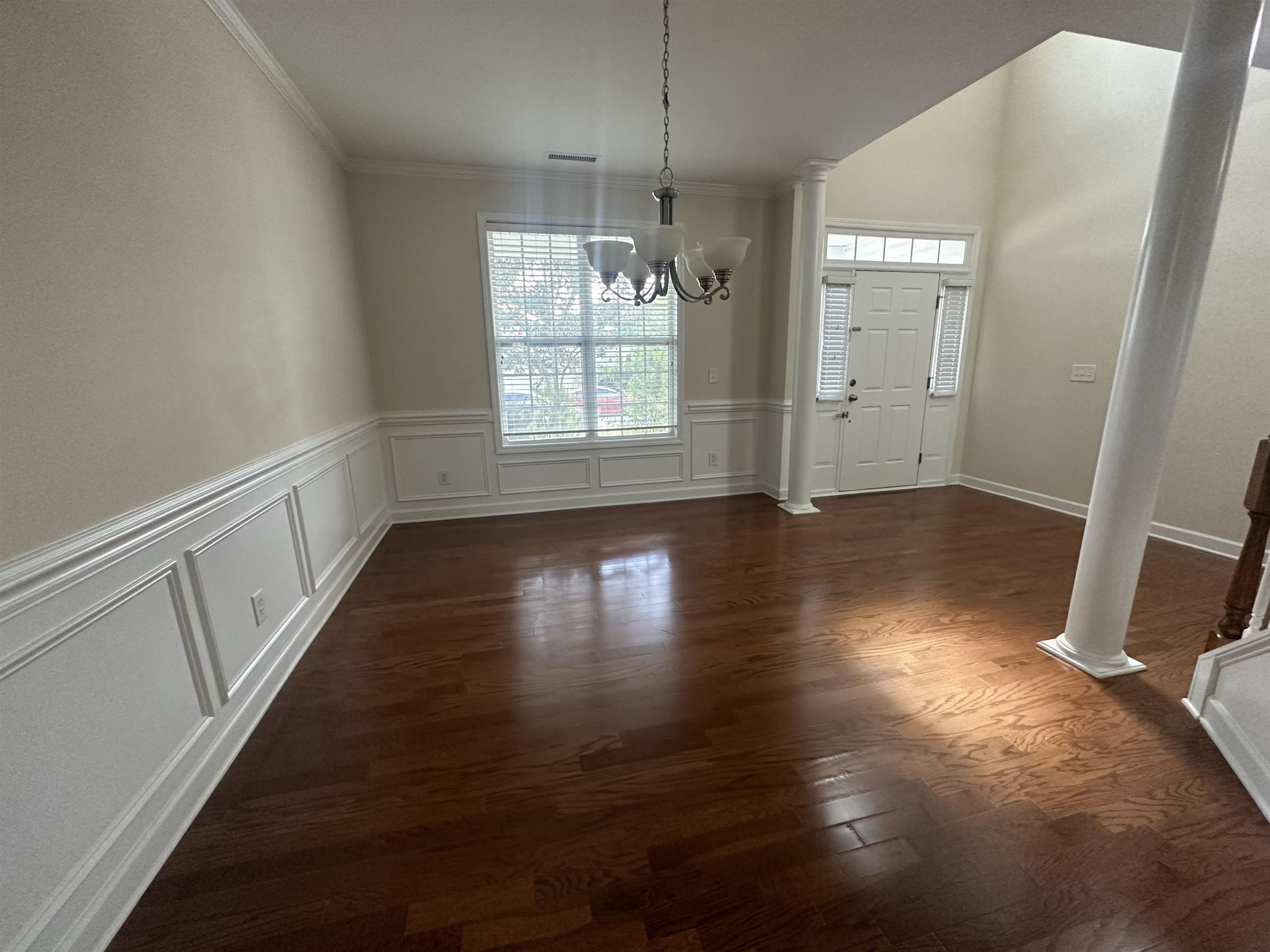 5161 Holly Ridge Farm Road Raleigh, NC 27616 - Photo 15 of 35 an empty room with wooden floor and windows