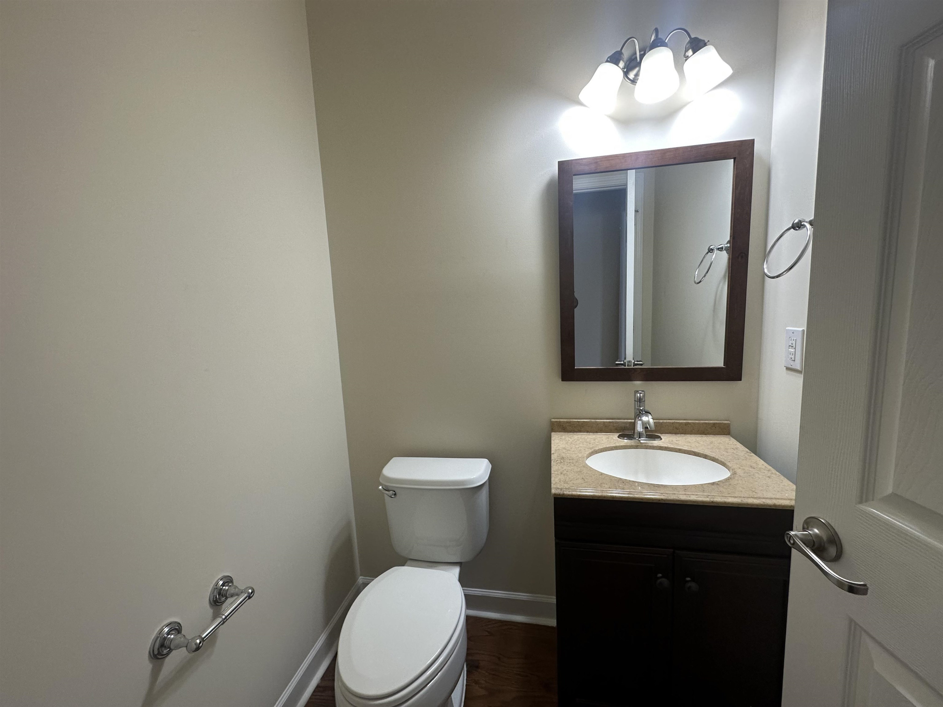 5161 Holly Ridge Farm Road Raleigh, NC 27616 - Photo 17 of 35 a bathroom with a toilet sink and mirror
