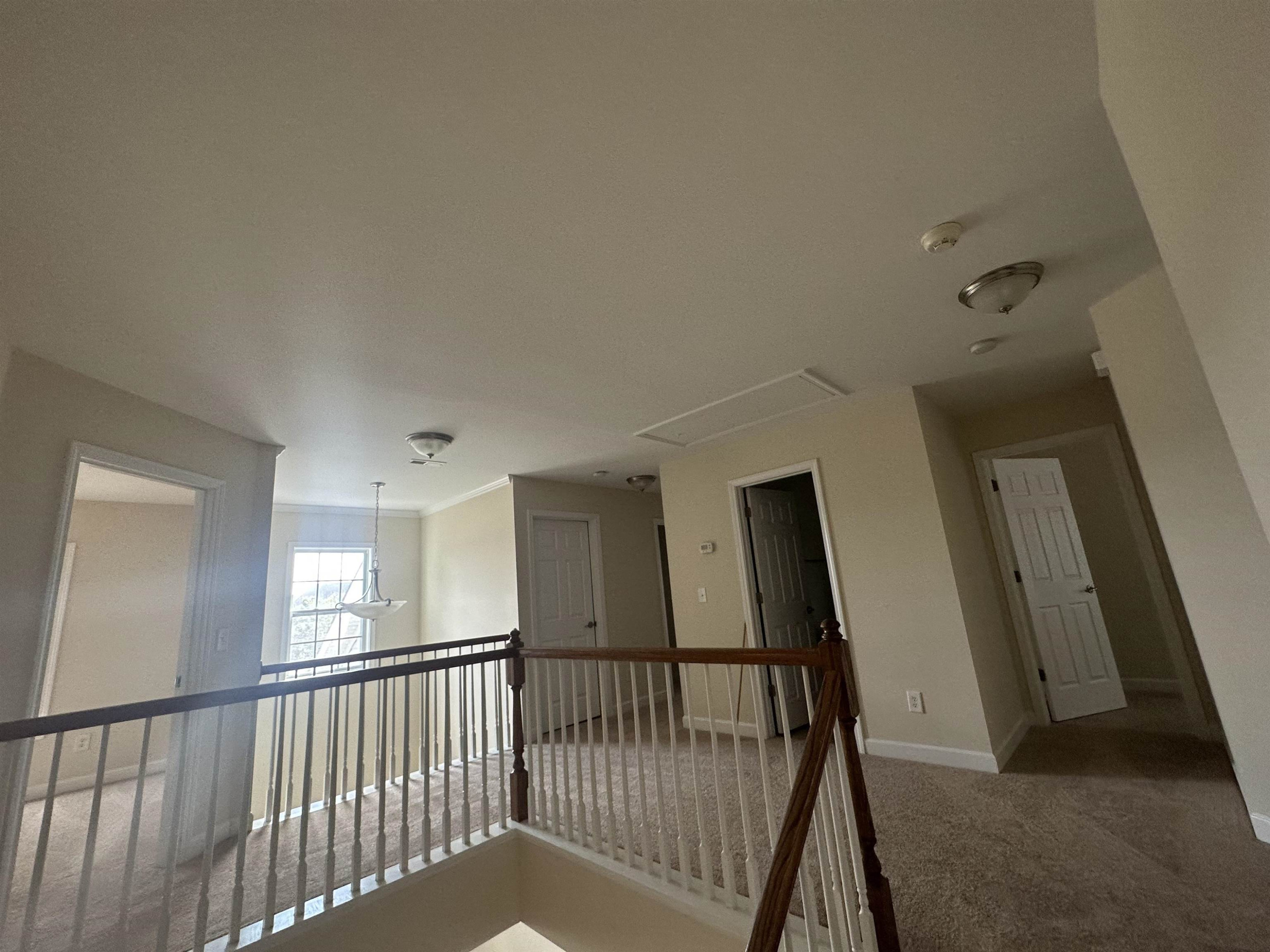 5161 Holly Ridge Farm Road Raleigh, NC 27616 - Photo 18 of 35 a view of a hallway with staircase