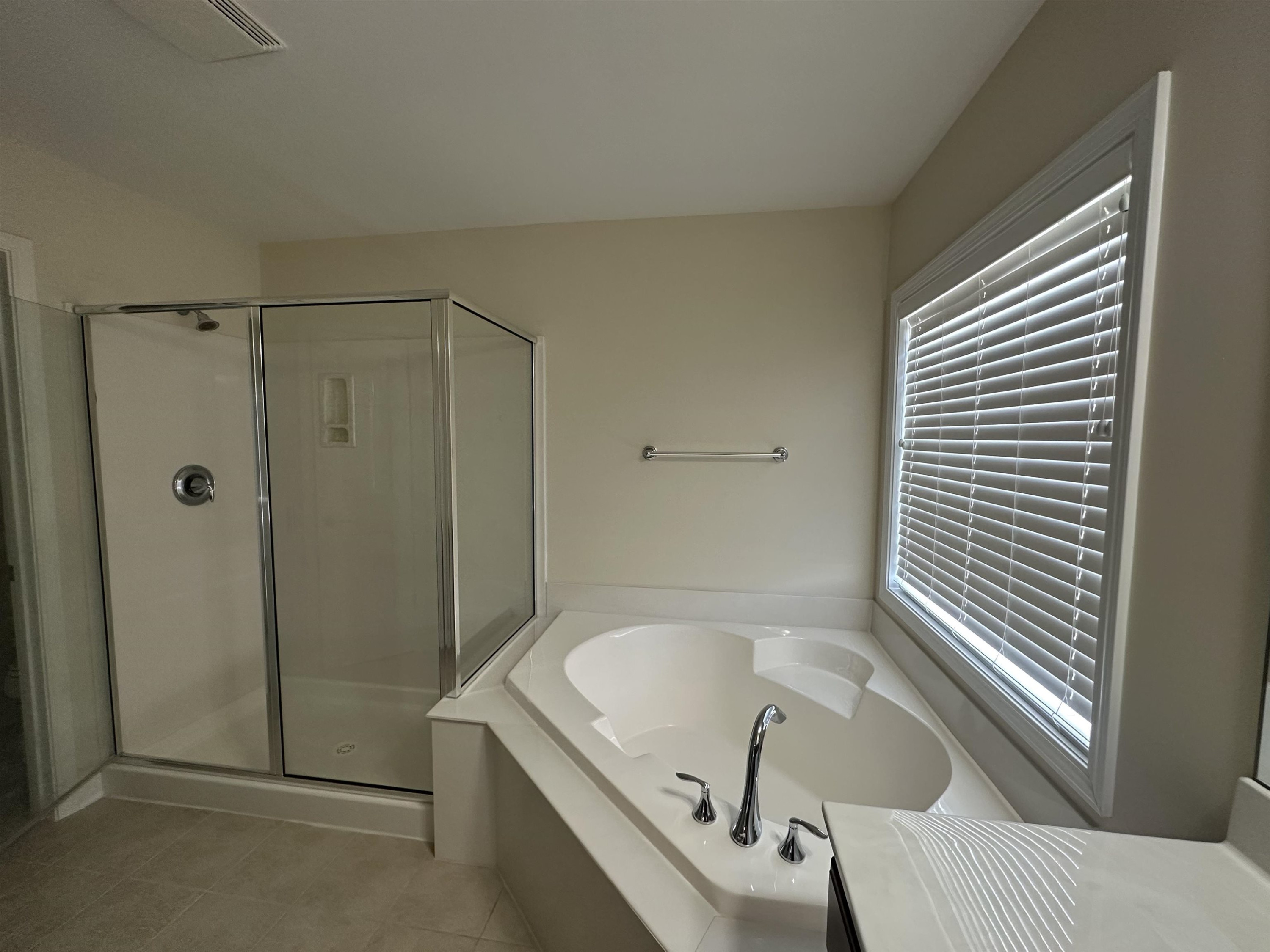 5161 Holly Ridge Farm Road Raleigh, NC 27616 - Photo 22 of 35 a bathroom with a tub and shower