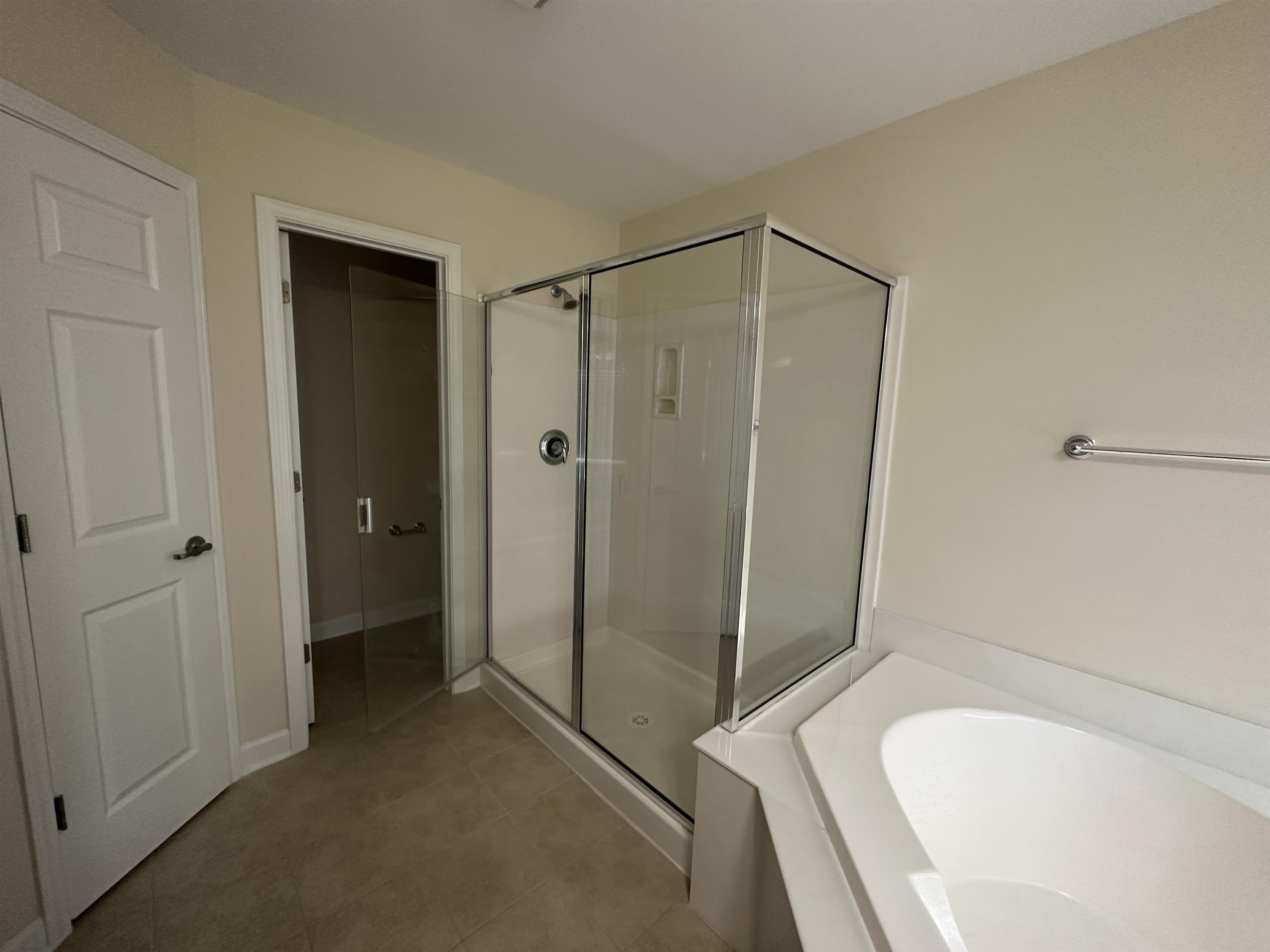 5161 Holly Ridge Farm Road Raleigh, NC 27616 - Photo 23 of 35 a bathroom with a tub and shower
