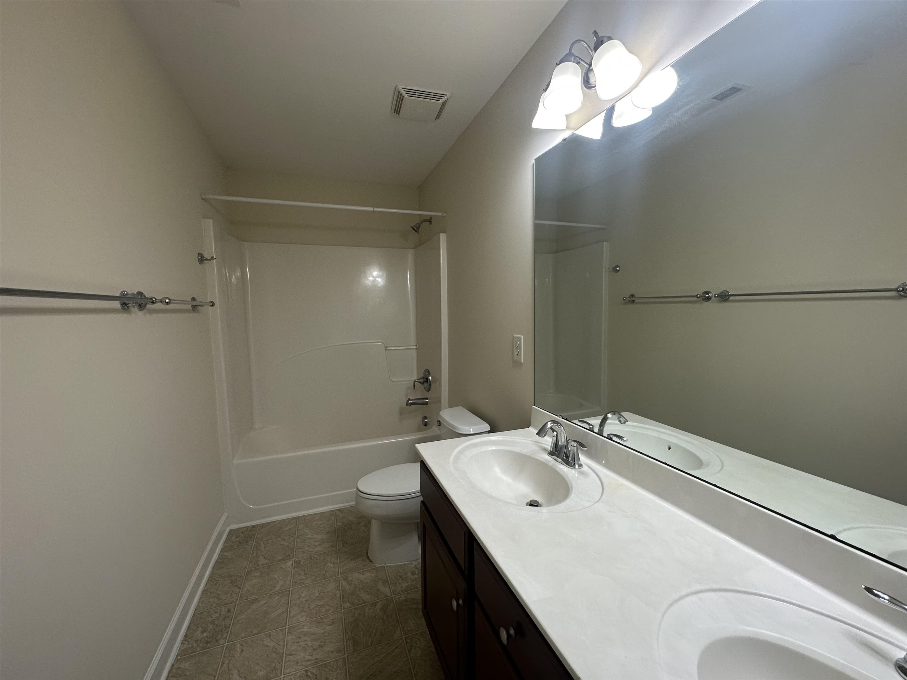 5161 Holly Ridge Farm Road Raleigh, NC 27616 - Photo 27 of 35 a bathroom with a sink a light fixture and a mirror