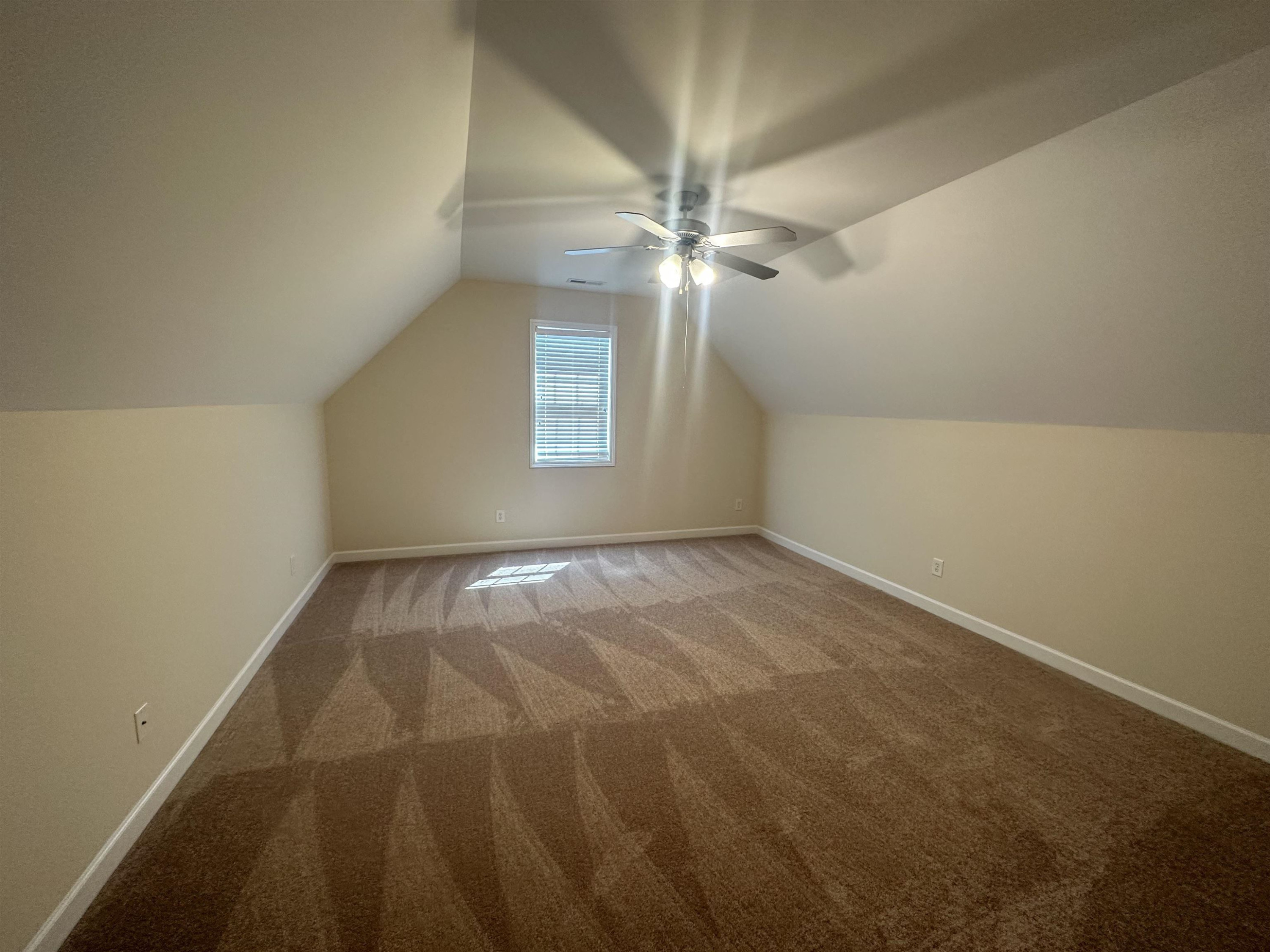 5161 Holly Ridge Farm Road Raleigh, NC 27616 - Photo 29 of 35 an empty room with a ceiling fan and window