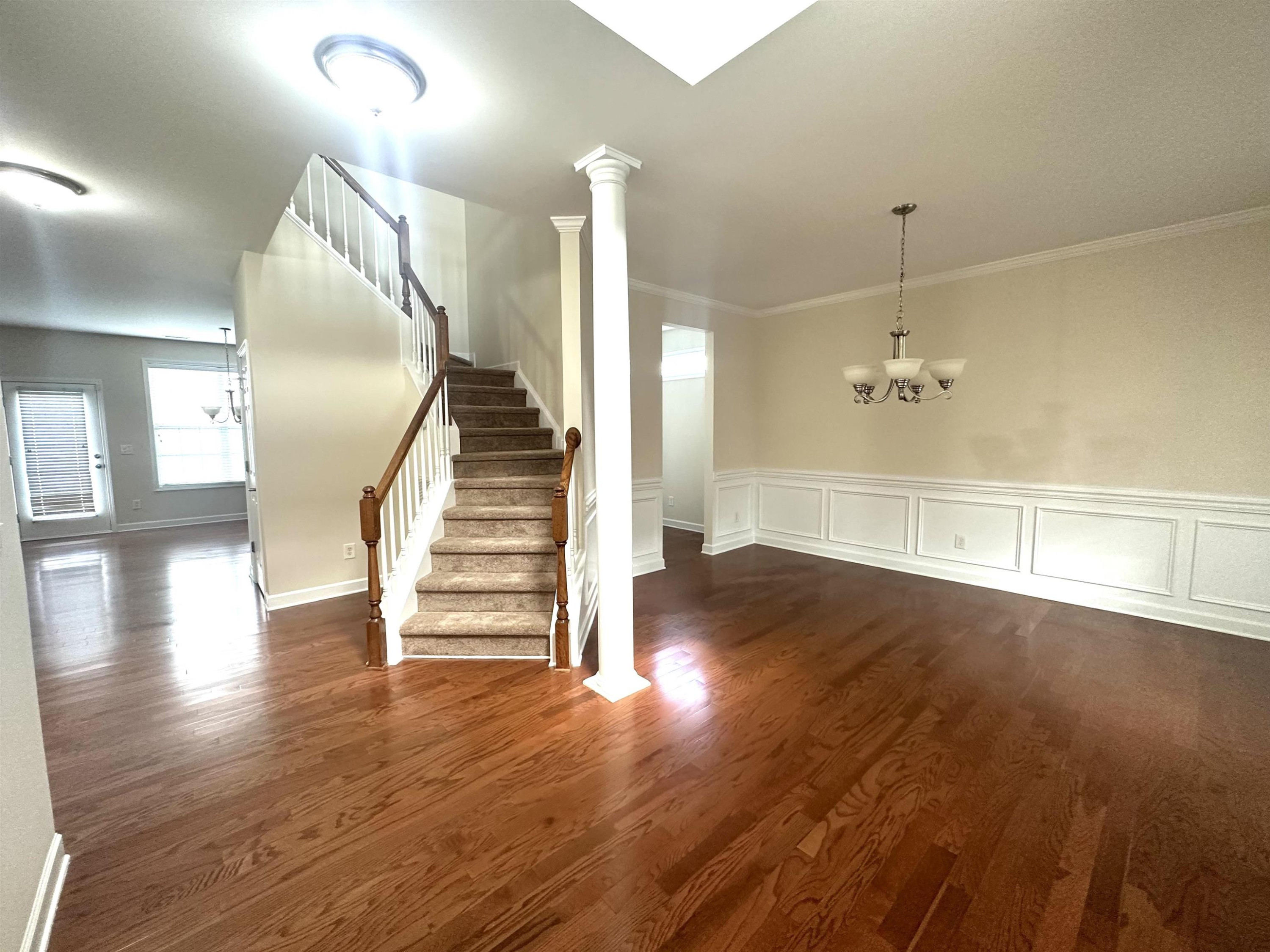 5161 Holly Ridge Farm Road Raleigh, NC 27616 - Photo 4 of 35 a view of a room with wooden floors and stairs
