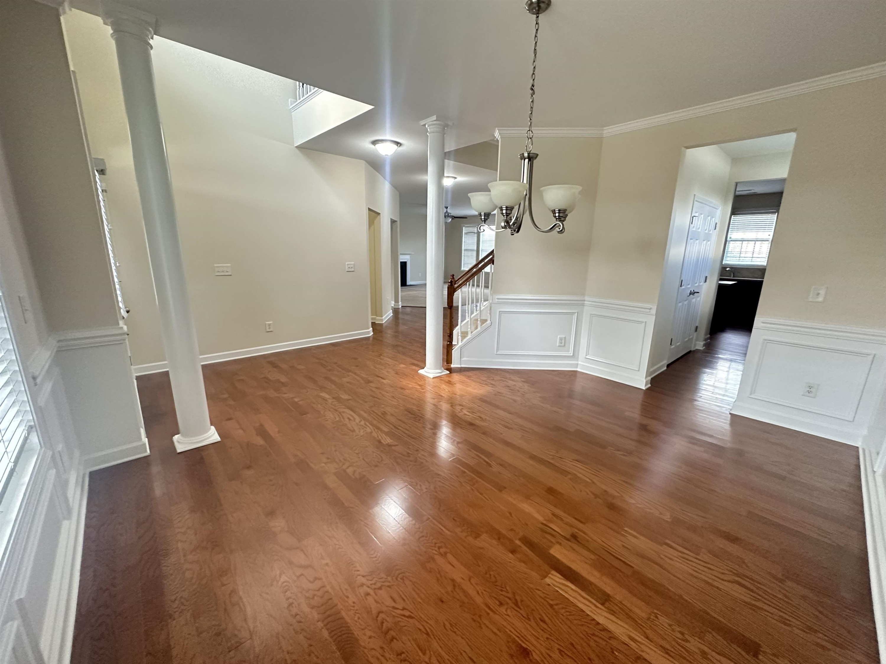 5161 Holly Ridge Farm Road Raleigh, NC 27616 - Photo 6 of 35 a view of a big room with wooden floor and a ceiling fan