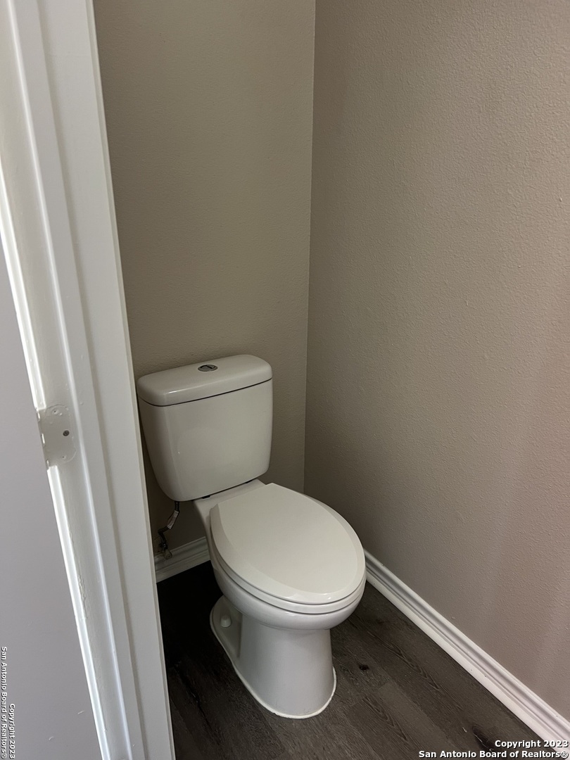 10027 Vasso View, Unit 3 Converse, TX 78109 - Photo 12 of 33 a white toilet sitting next to a sink