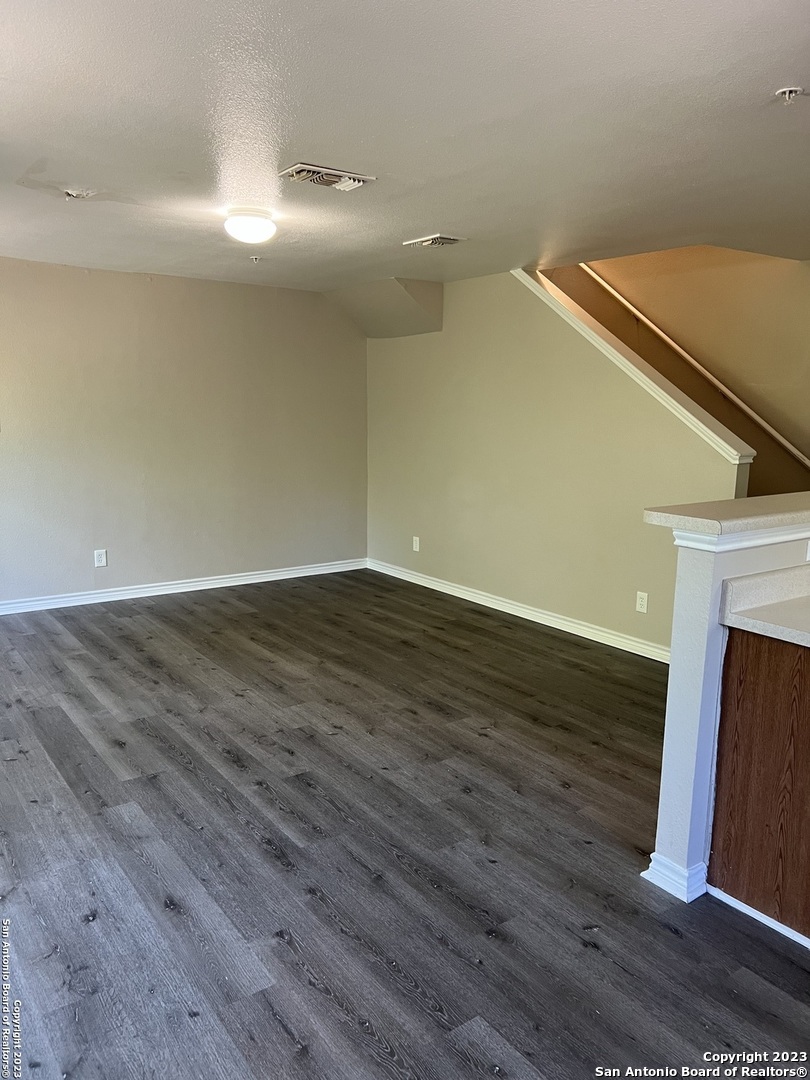 10027 Vasso View, Unit 3 Converse, TX 78109 - Photo 14 of 33 a view of an empty room with wooden floor