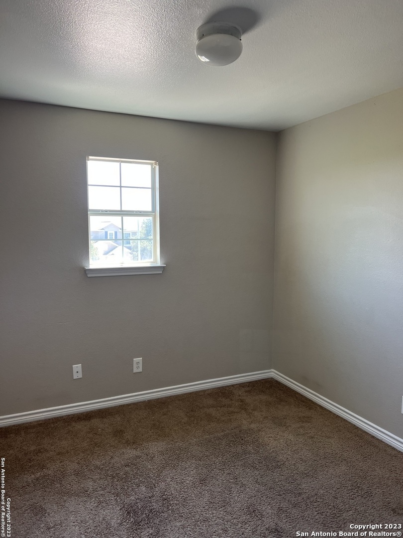 10027 Vasso View, Unit 3 Converse, TX 78109 - Photo 18 of 33 an empty room with a empty space and window
