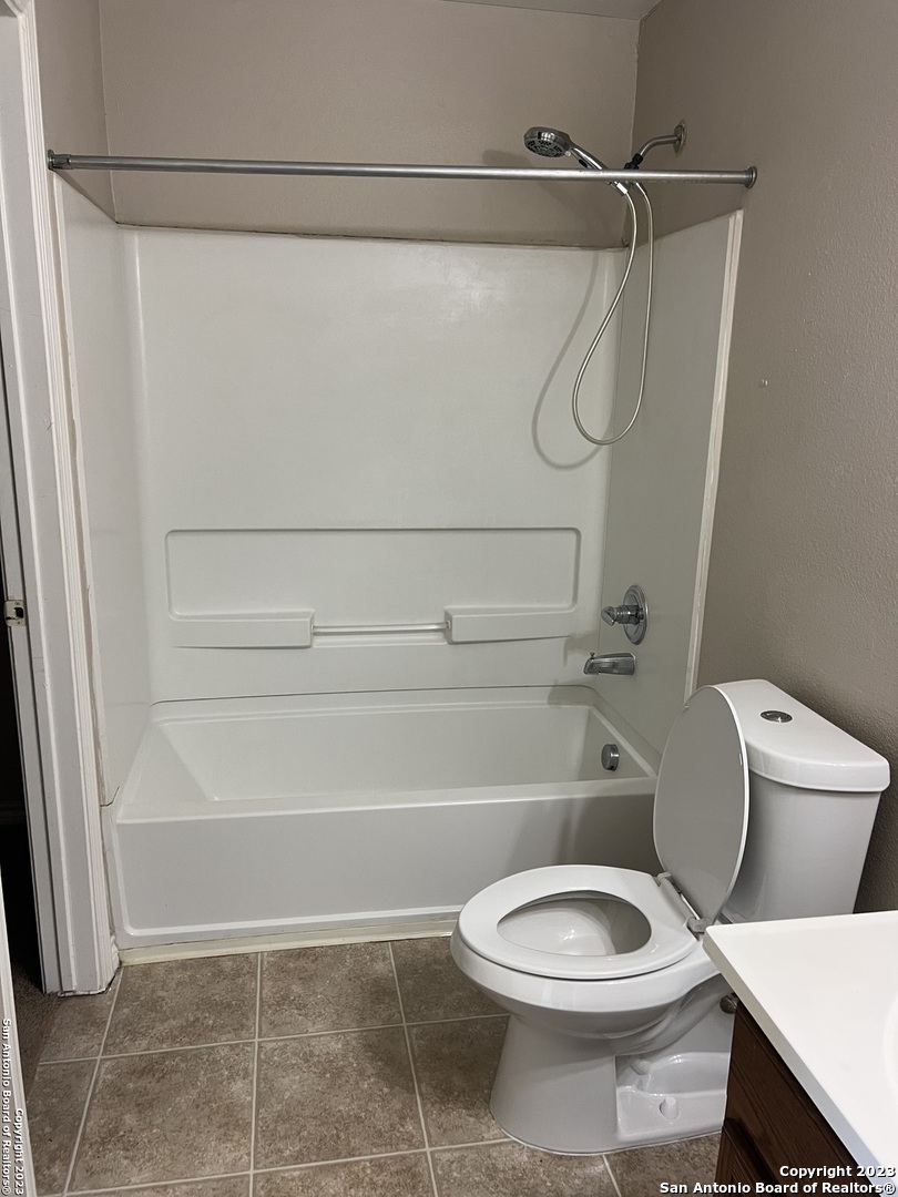 10027 Vasso View, Unit 3 Converse, TX 78109 - Photo 20 of 33 a bathroom with a toilet and a shower