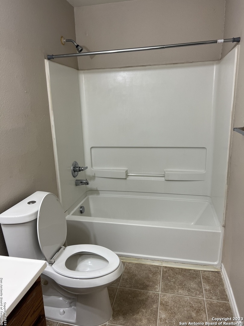 10027 Vasso View, Unit 3 Converse, TX 78109 - Photo 21 of 33 a bathroom with a toilet and a shower