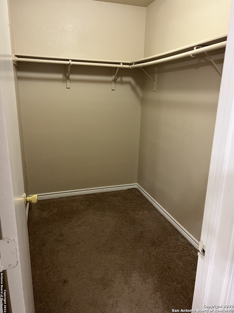 10027 Vasso View, Unit 3 Converse, TX 78109 - Photo 24 of 33 a view of small space with racks on the wall