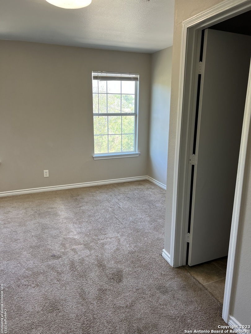 10027 Vasso View, Unit 3 Converse, TX 78109 - Photo 25 of 33 an empty room with windows