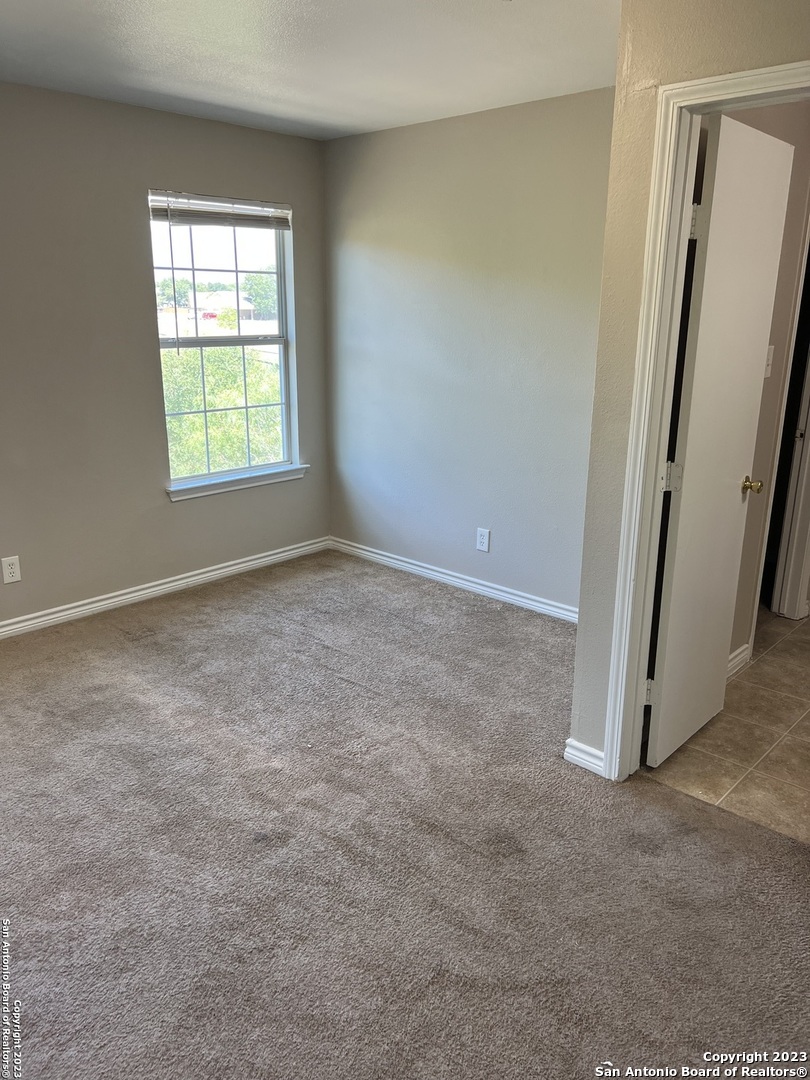 10027 Vasso View, Unit 3 Converse, TX 78109 - Photo 27 of 33 an empty room with windows