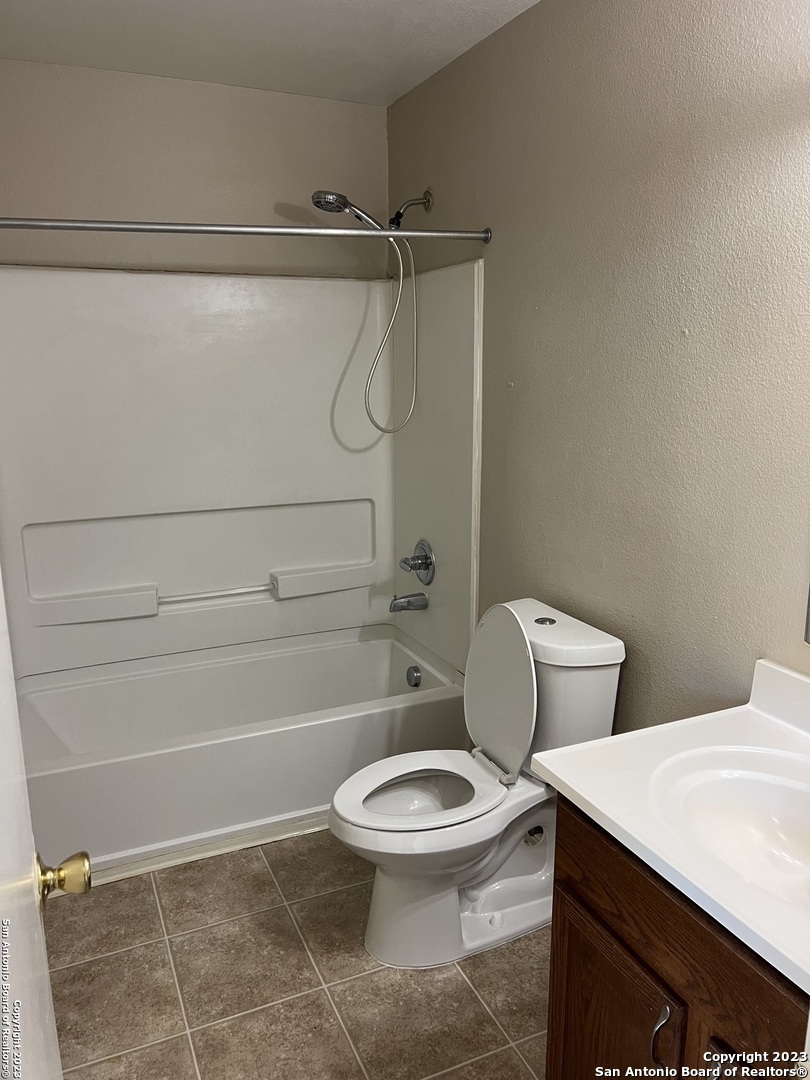 10027 Vasso View, Unit 3 Converse, TX 78109 - Photo 29 of 33 a bathroom with a toilet and shower
