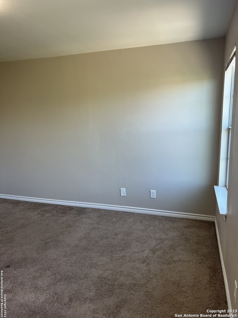 10027 Vasso View, Unit 3 Converse, TX 78109 - Photo 31 of 33 a view of an empty room and window