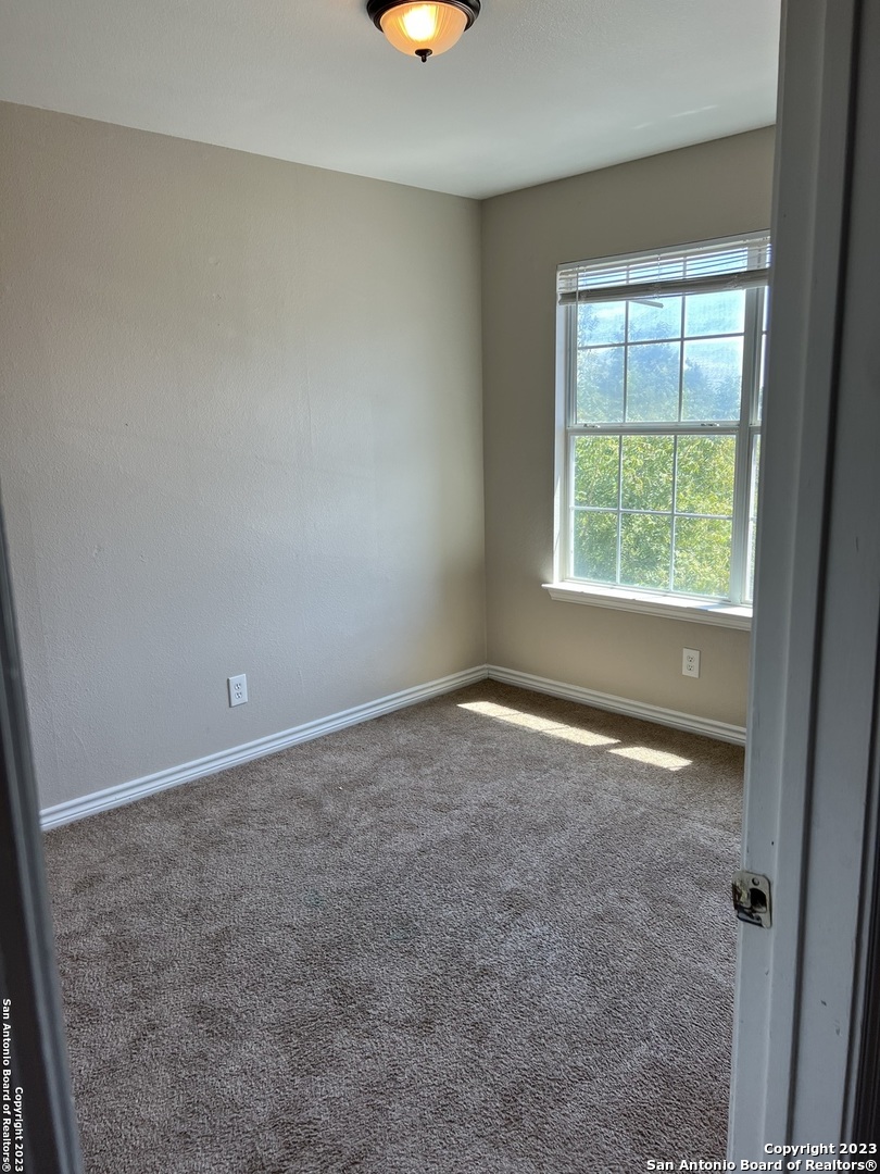 10027 Vasso View, Unit 3 Converse, TX 78109 - Photo 33 of 33 an empty room with a window