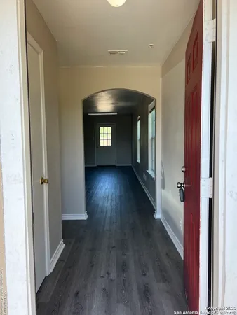 a view of hallway with wooden floor