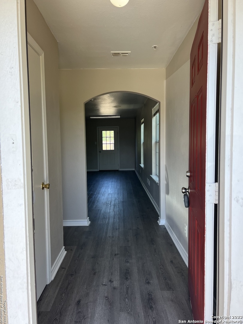10027 Vasso View, Unit 3 Converse, TX 78109 - Photo 9 of 33 a view of hallway with wooden floor