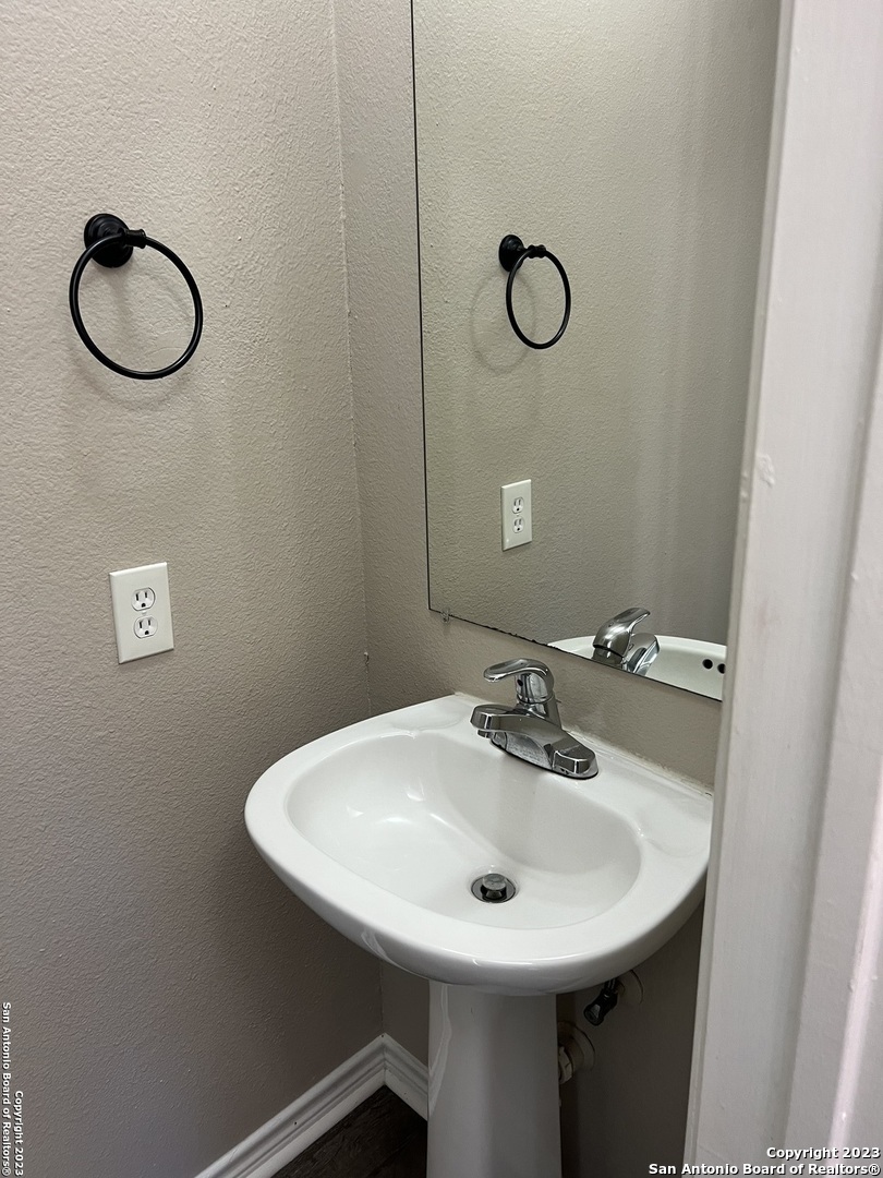 10027 Vasso View, Unit 3 Converse, TX 78109 - Photo 10 of 33 a bathroom with a sink and a mirror