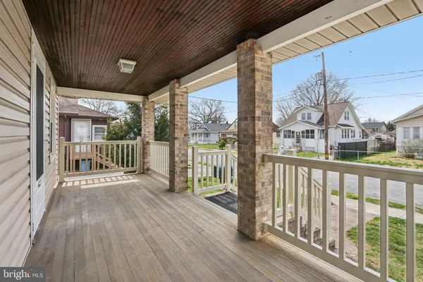a view of a balcony with wooden floor