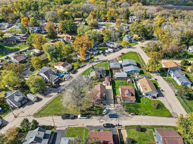 an aerial view of residential houses with outdoor space