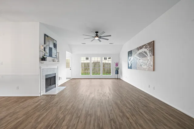 a view of livingroom with furniture wooden floor and window