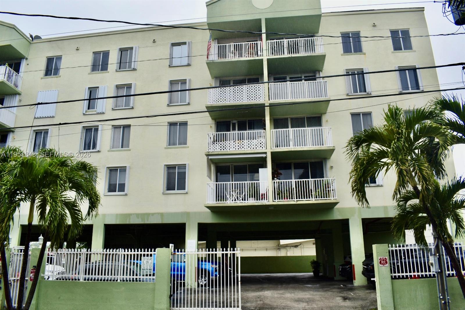 616 Northwest 26th Avenue, Unit 210 Miami, FL 33125 - Photo 1 of 23 a large building with a window and balcony