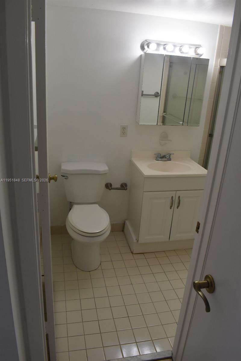 616 Northwest 26th Avenue, Unit 210 Miami, FL 33125 - Photo 13 of 23 a bathroom with a sink toilet and shower