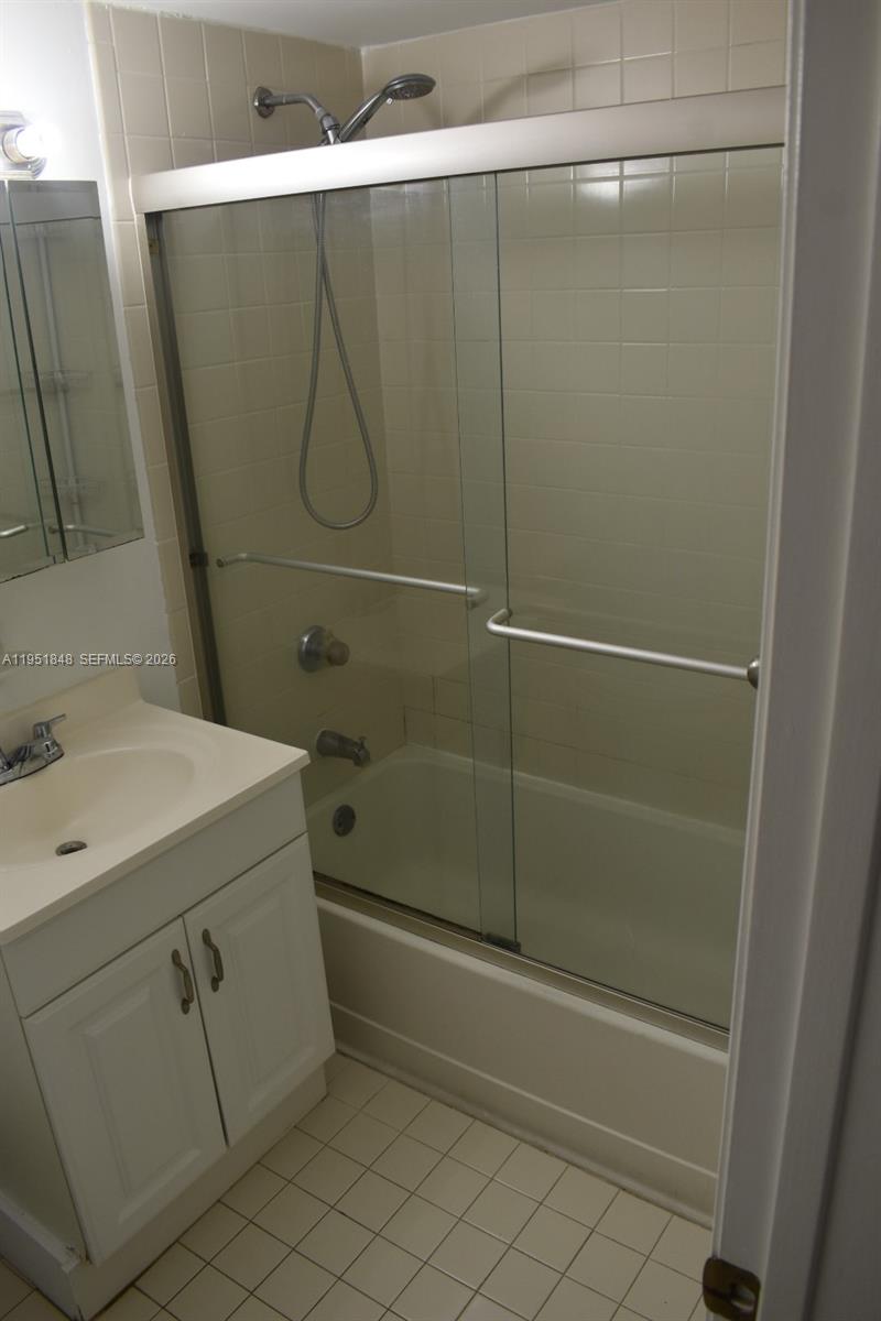 616 Northwest 26th Avenue, Unit 210 Miami, FL 33125 - Photo 14 of 23 a bathroom with a shower and a sink