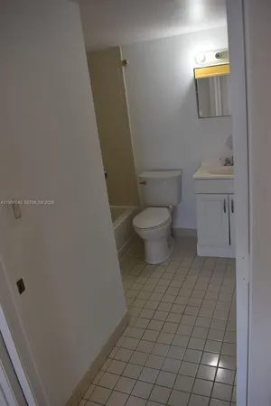 a bathroom with a toilet and a sink