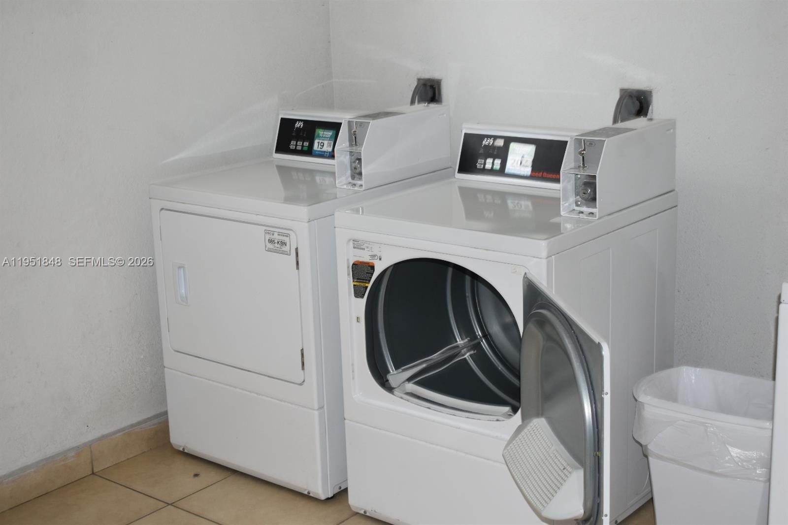 616 Northwest 26th Avenue, Unit 210 Miami, FL 33125 - Photo 18 of 23 a utility room with dryer and washer