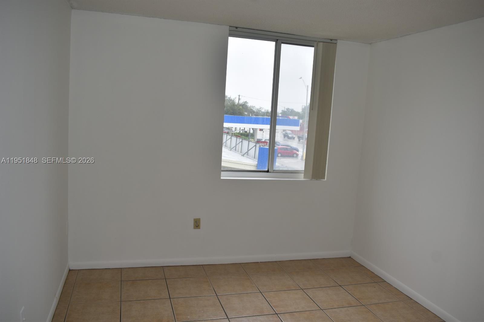 616 Northwest 26th Avenue, Unit 210 Miami, FL 33125 - Photo 10 of 23 a view of an empty room with a window