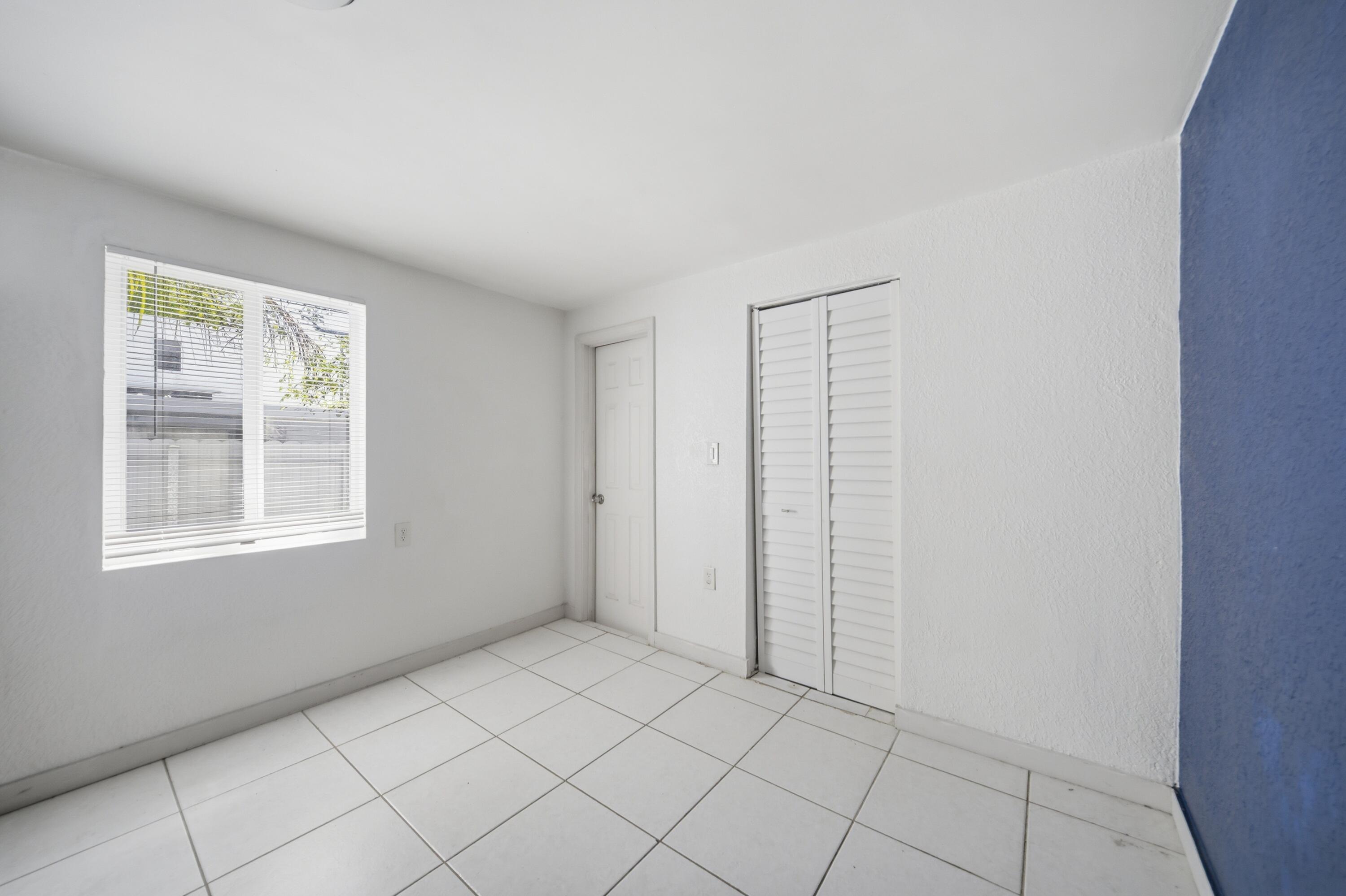 1796 Northwest 112th Street Miami, FL 33167 - Photo 18 of 25 an empty room with windows
