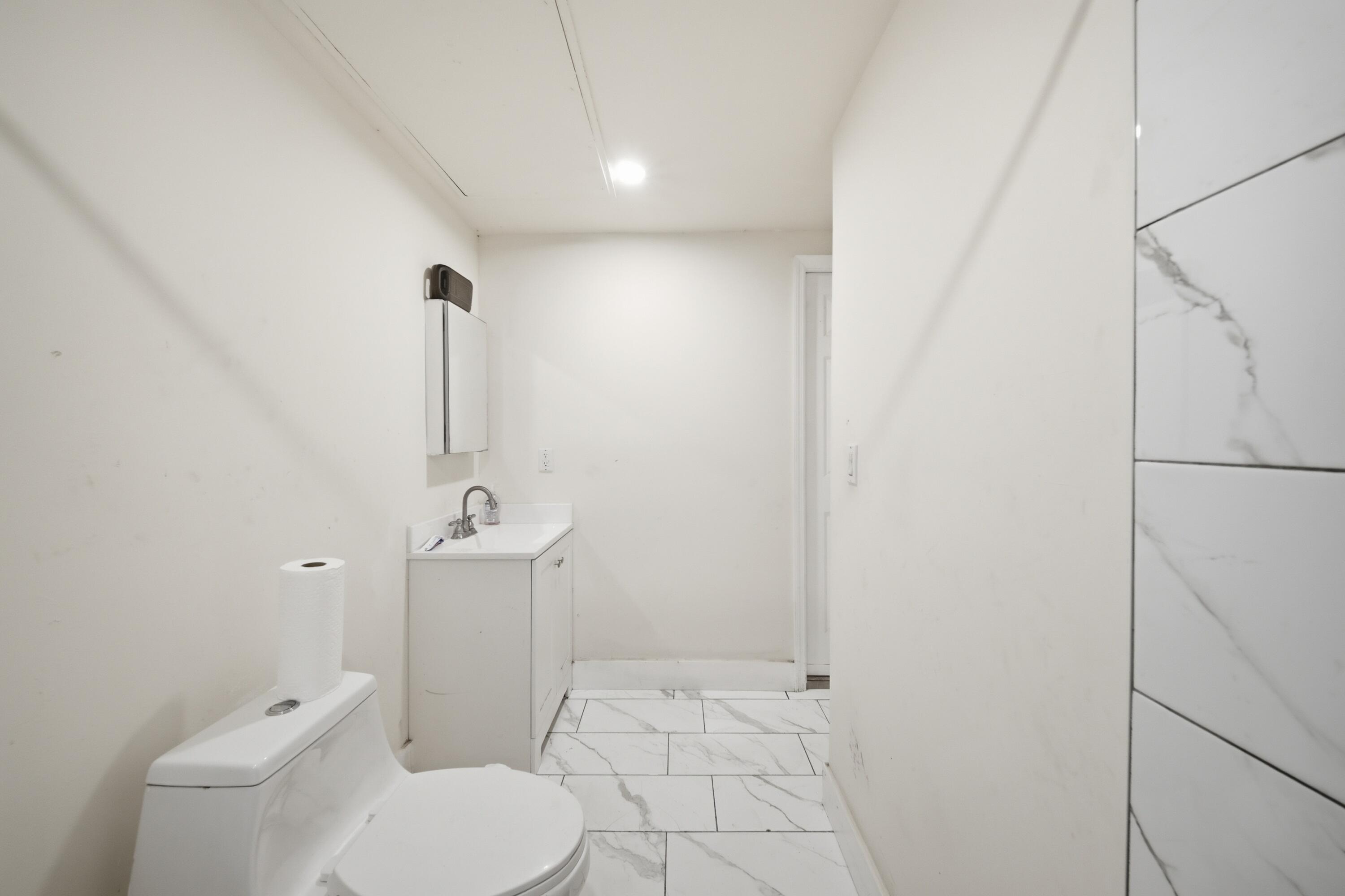 1796 Northwest 112th Street Miami, FL 33167 - Photo 6 of 25 a bathroom with a toilet and a shower