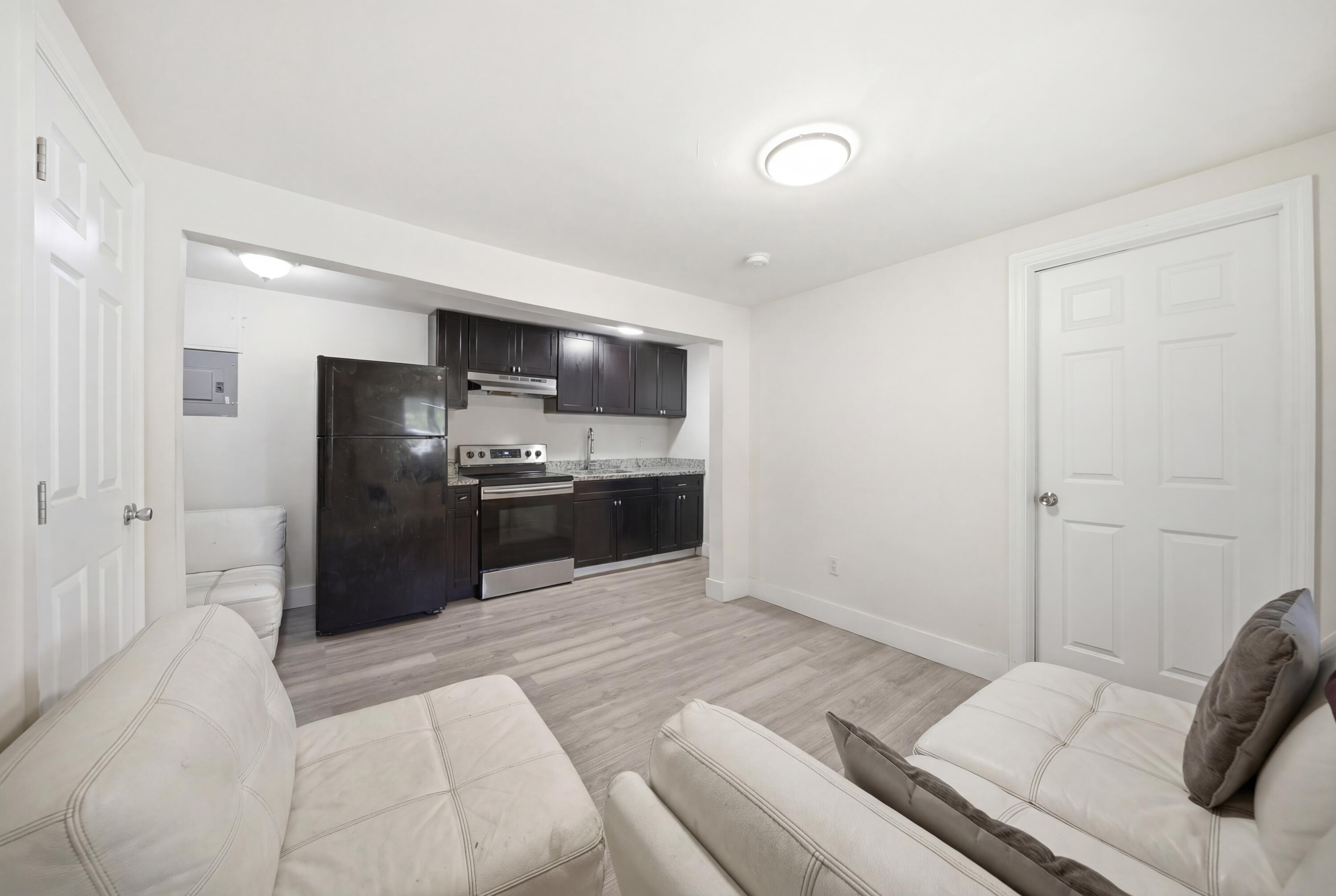 1796 Northwest 112th Street Miami, FL 33167 - Photo 10 of 25 a kitchen with a refrigerator and a sink