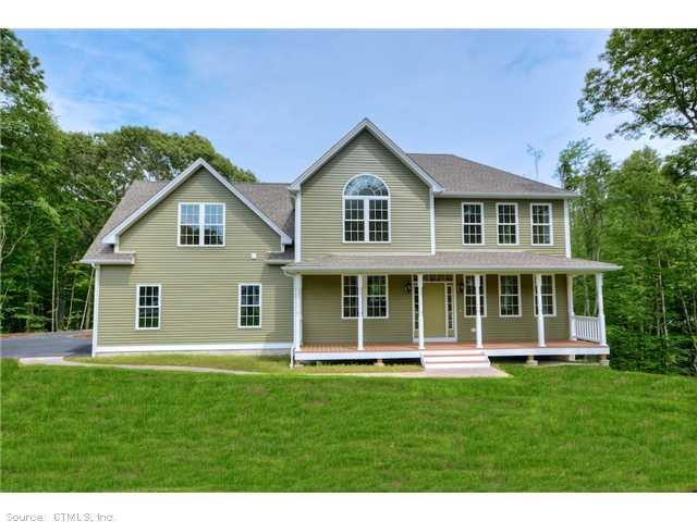 4 Stoddards View Ledyard, CT 06335 - Photo 1 of 1 a front view of a house with a yard