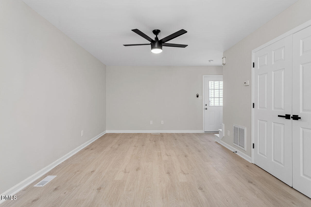 389 East Williams Street Angier, NC 27501 - Photo 16 of 29 wooden floor in an empty room