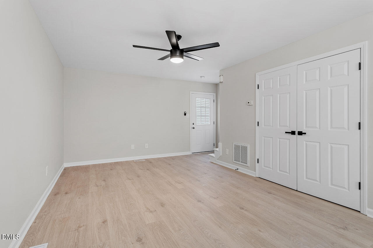 389 East Williams Street Angier, NC 27501 - Photo 17 of 29 wooden floor in an empty room
