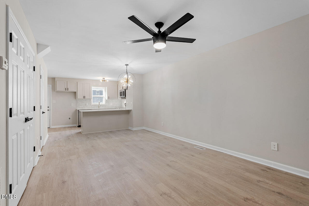 389 East Williams Street Angier, NC 27501 - Photo 20 of 29 an empty room with closet and windows