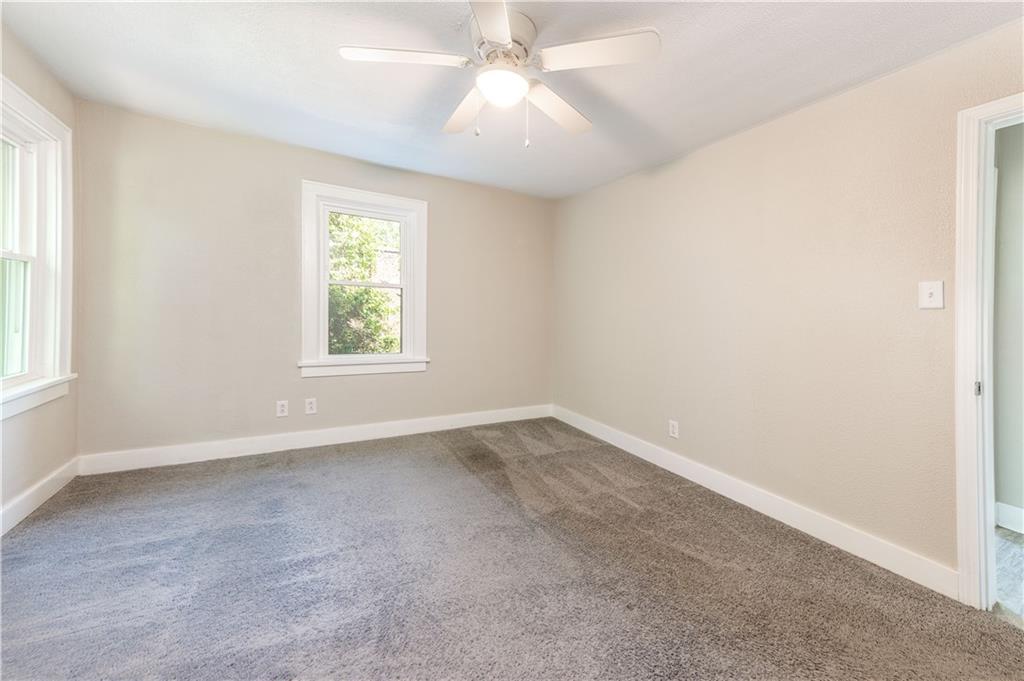 718 Maytide Street Pittsburgh, PA 15227 - Photo 8 of 19 an empty room with a window and a fan