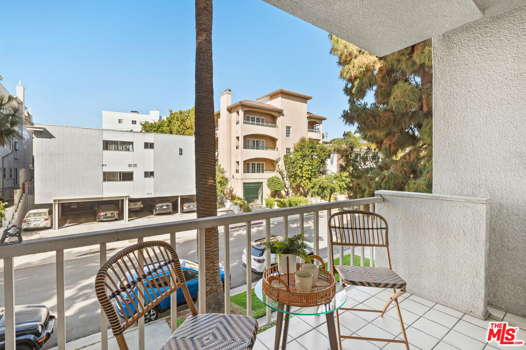1710 Malcolm Avenue, Unit 101 Los Angeles, CA 90024 - Photo 17 of 18 a view of balcony with a couple of chairs