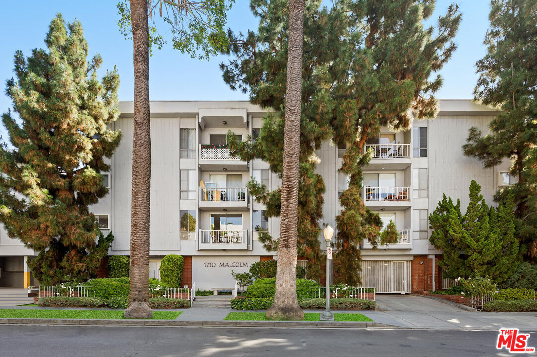 1710 Malcolm Avenue, Unit 101 Los Angeles, CA 90024 - Photo 18 of 18 a front view of a residential houses with yard and green space