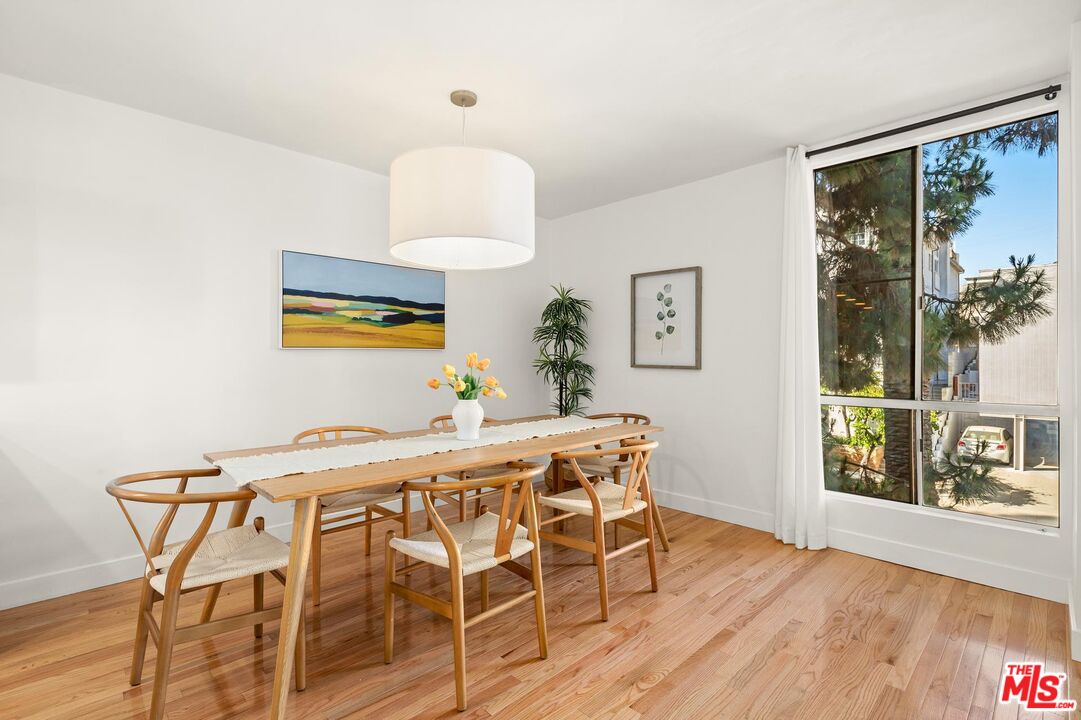 1710 Malcolm Avenue, Unit 101 Los Angeles, CA 90024 - Photo 6 of 18 a dining room with furniture and wooden floor