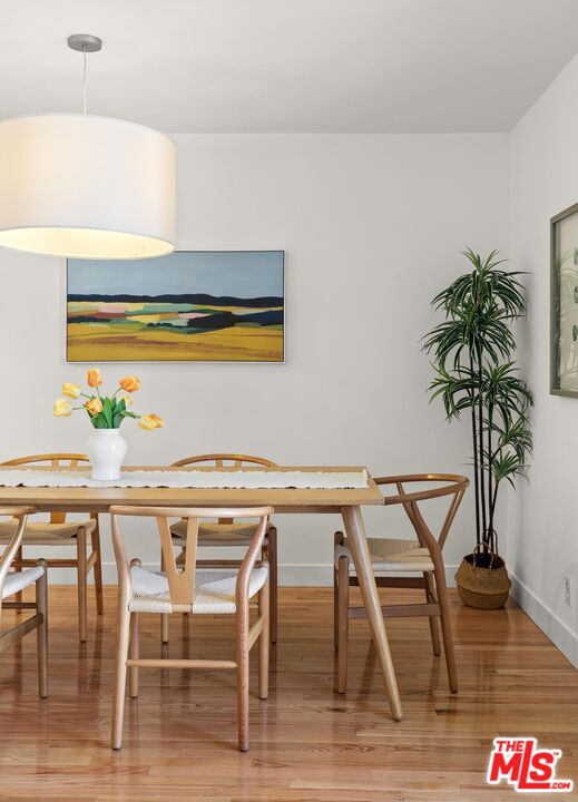 1710 Malcolm Avenue, Unit 101 Los Angeles, CA 90024 - Photo 7 of 18 a view of a dining room with furniture and wooden floor