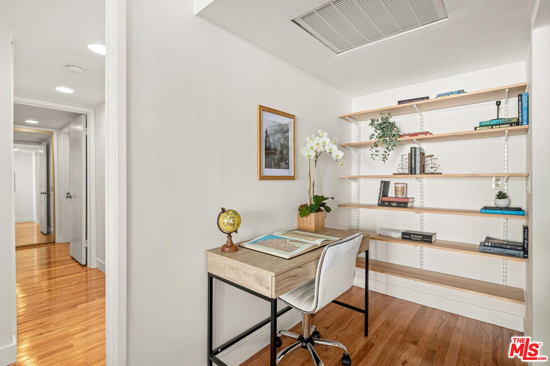 1710 Malcolm Avenue, Unit 101 Los Angeles, CA 90024 - Photo 10 of 18 a workspace with furniture and wooden floor