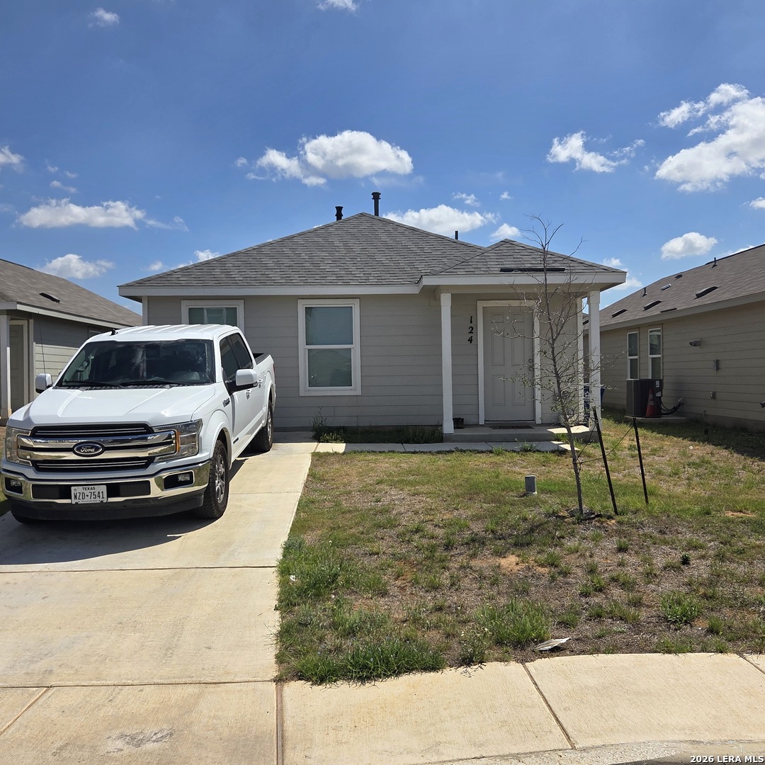 124 Horseshoe Trail Pleasanton, TX 78064 - Photo 1 of 16 a view of a car parked in front of a house